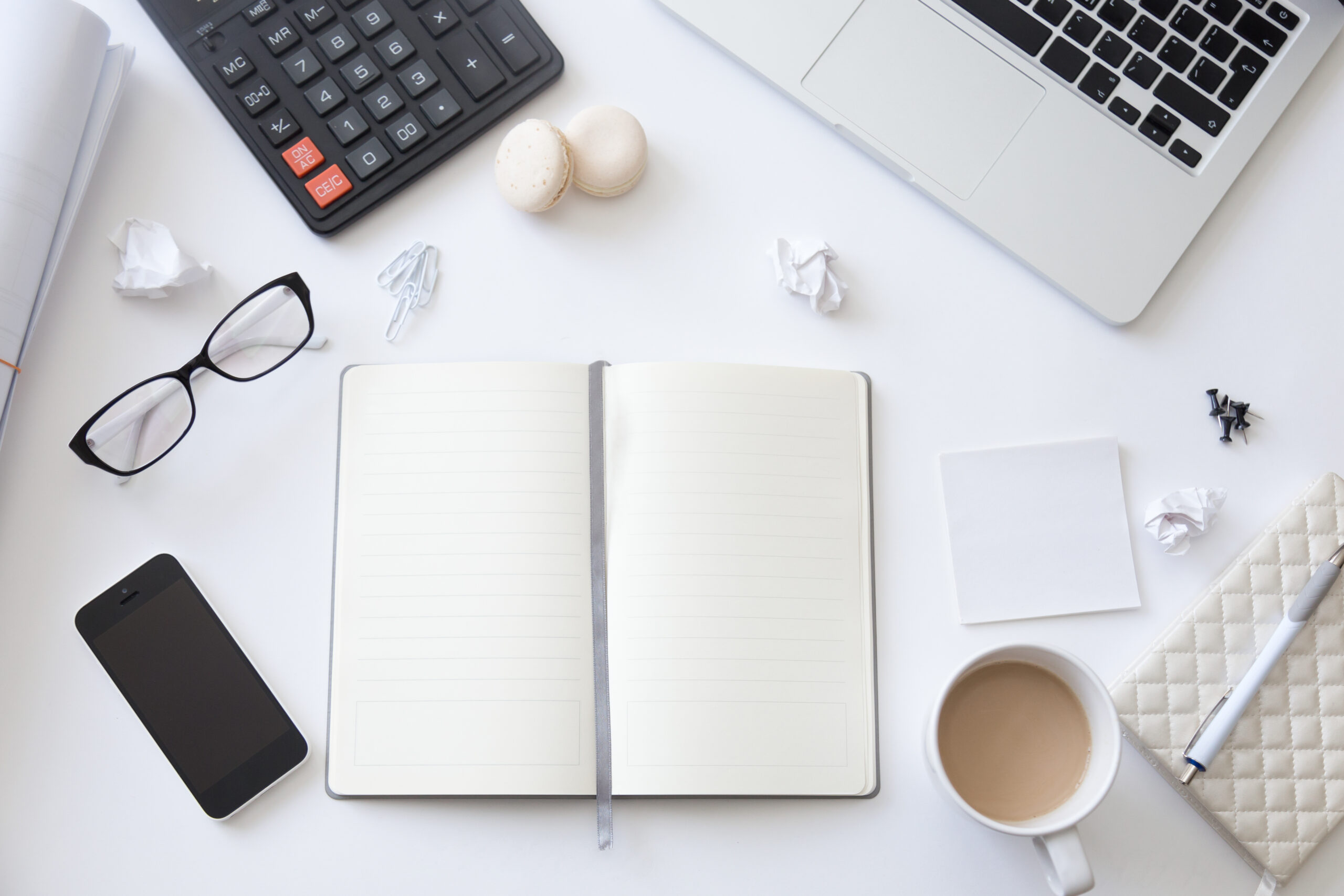 top view working desk with open blank notebook scaled